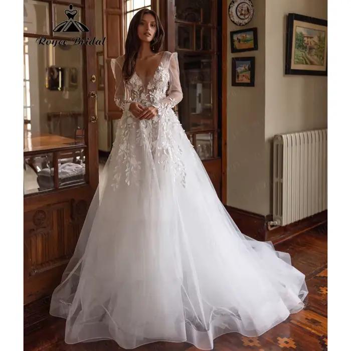 Robe de mariée en dentelle florale avec corsage transparent, manches longues en tulle et jupe en tul