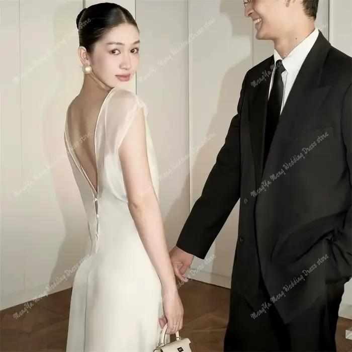 Robes de mariée sirène élégantes dos ouvert col rond Organza sans manches longueur au sol