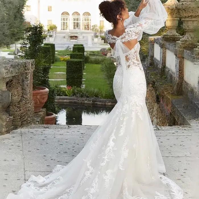 Robe de mariée sirène/trompette sexy avec appliques