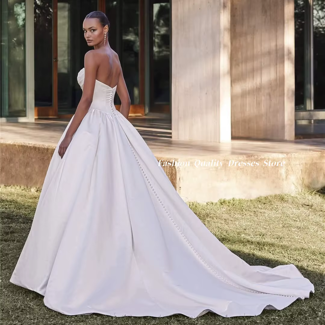 Robe de mariée en satin ivoire, bustier, avec corsage plissé à la taille, poches, dos perlé et longu