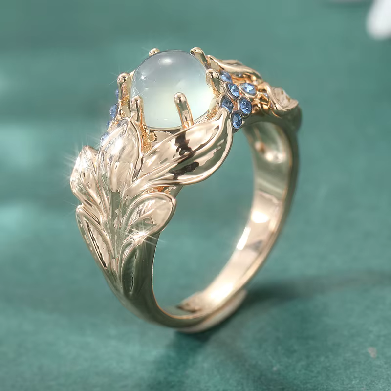 Magnifique bague pour femme incrustée de CZ bleu, couleur or, motif feuille sculpté à la main, bijou