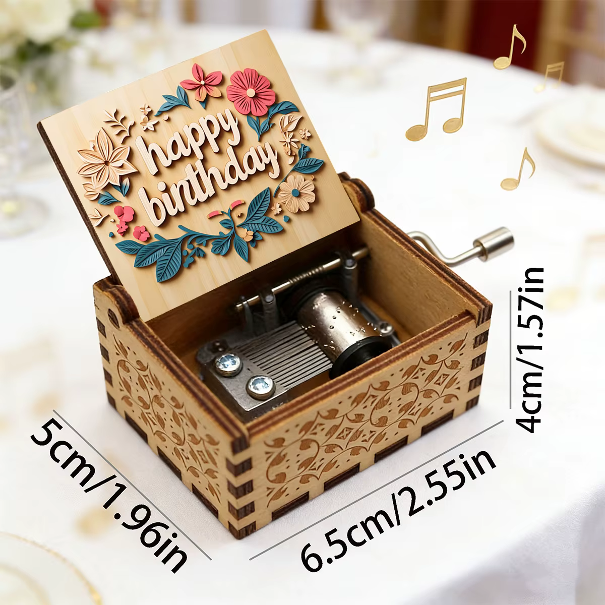 Boîte à musique en bois pour anniversaires, entourée de fleurs avec inscription 'Joyeux Anniversaire