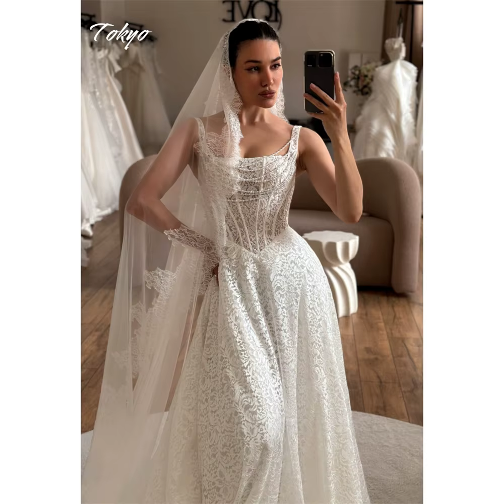 Tokyo personnalisé blanc a-ligne robes de mariée Spaghetti sangle sans manches dentelle robes de mar