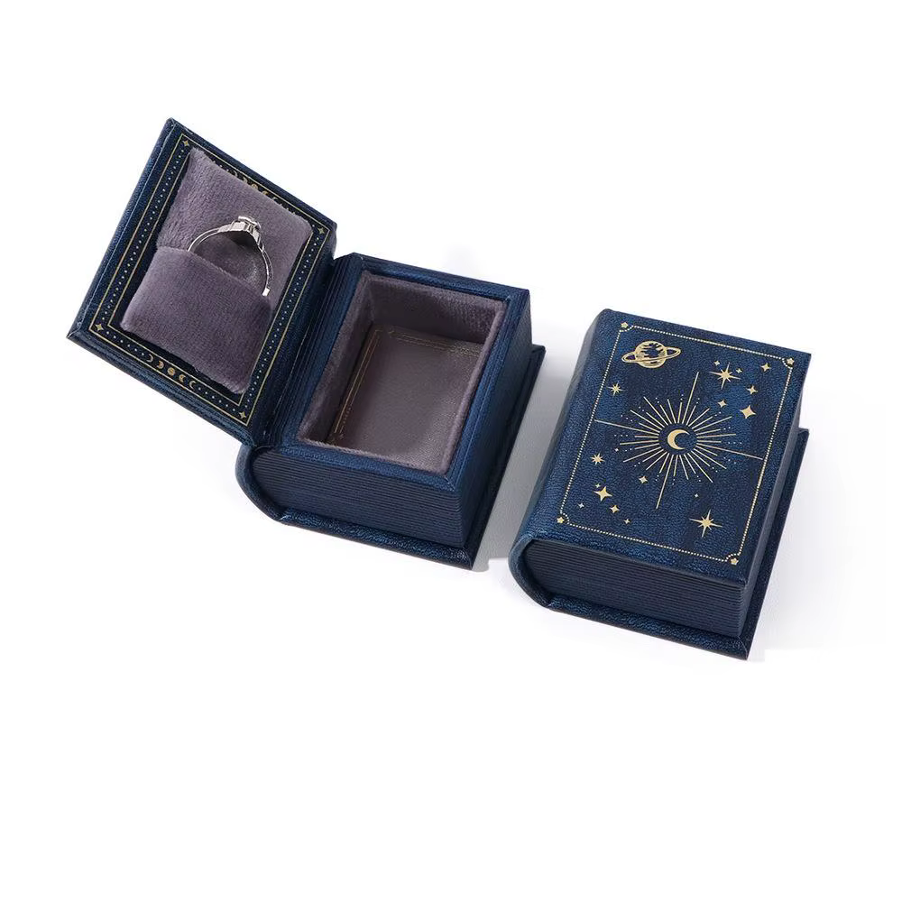 Boîte à bijoux en cuir, boîte à bagues en forme de livre avec doublure en tissu suédé, couvercle rab