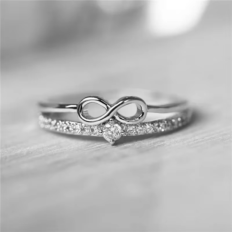 Bague tendance couleur or et argent pour femme, avec cristal blanc et zircon cubique, motif infini, 