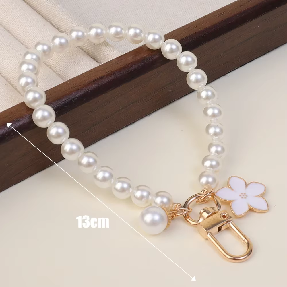 Porte-clés en perles de luxe pour femmes, bijoux brillants, coque de téléphone, sac à dos, accessoir