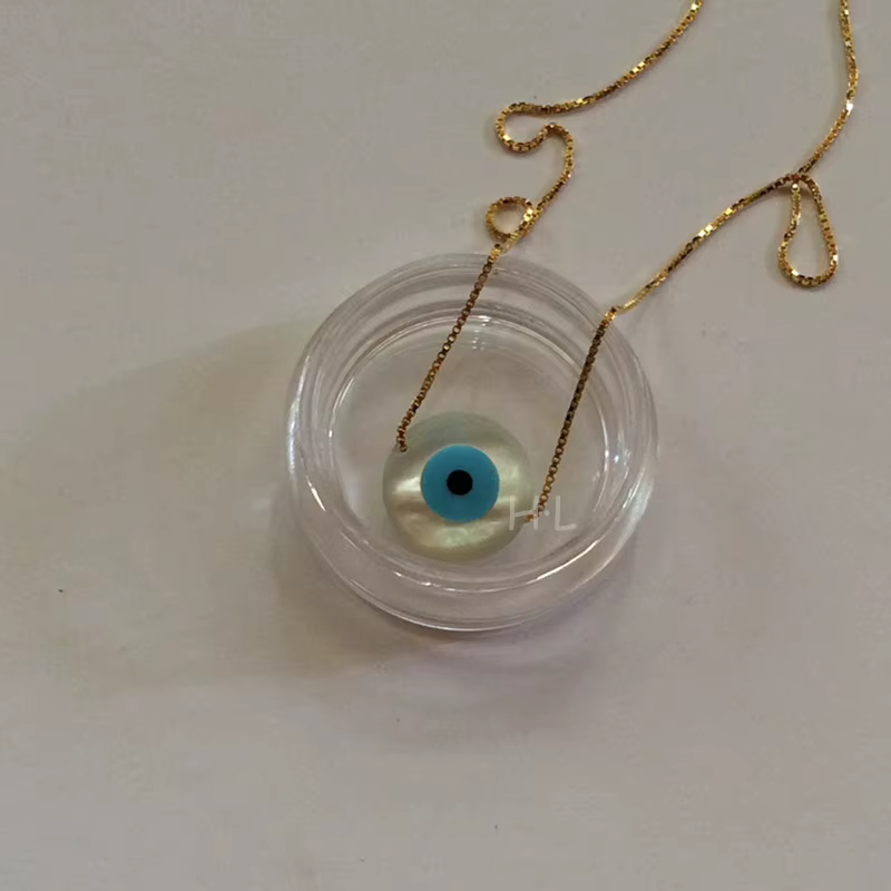 Collier ras-de-cou avec pendentif en coquille MOP œil de chat bleu