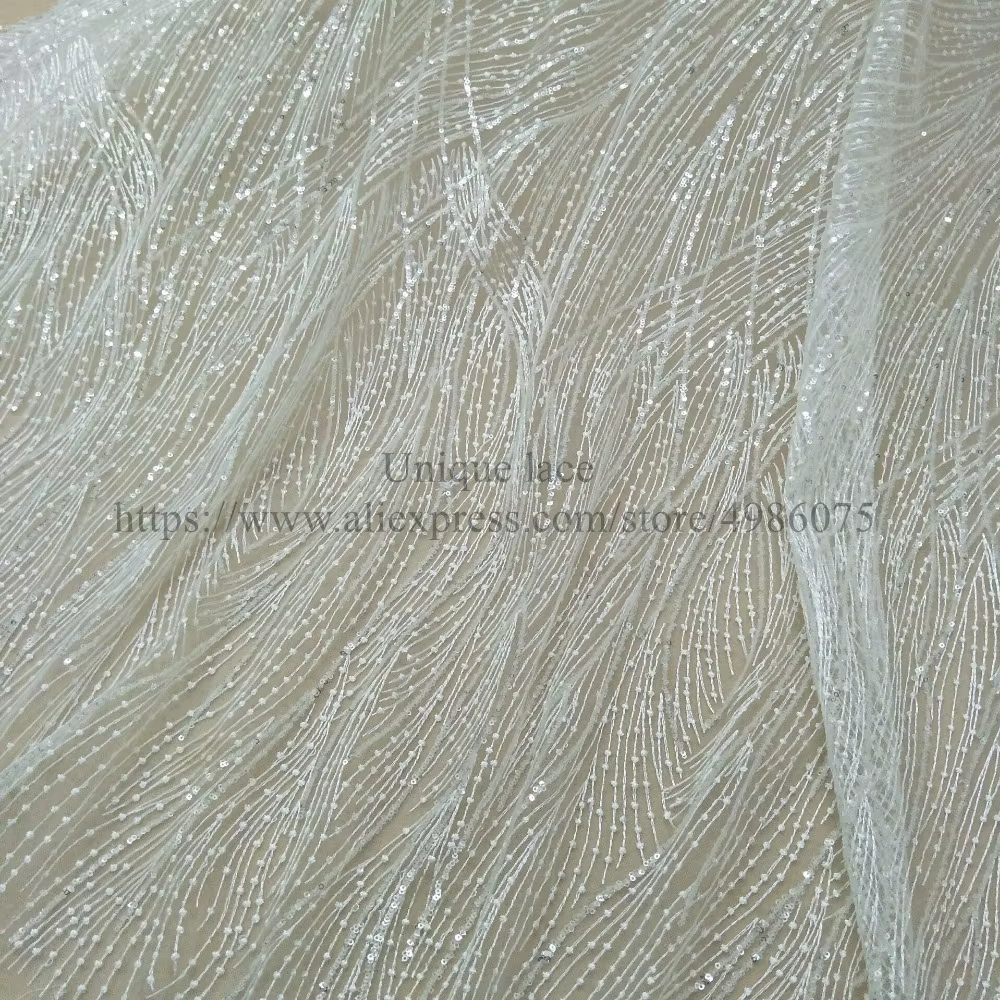 Tissu en dentelle ivoire pour robe de mariée