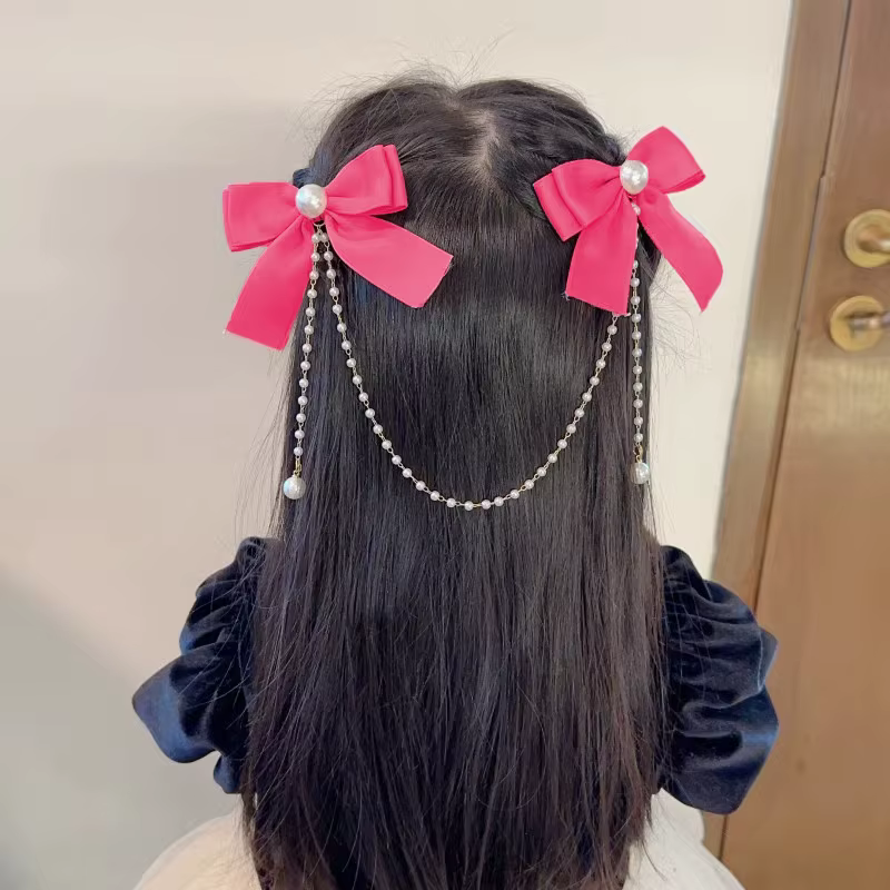 Pince à cheveux avec pompon en perles