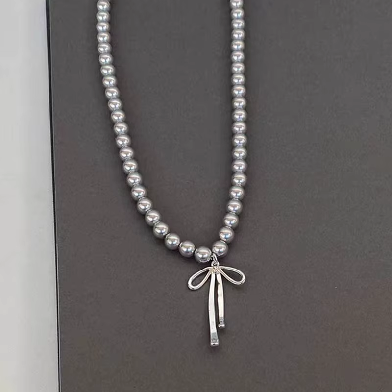 Pendentif ras du cou élégant avec nœud papillon en perles gracieuses pour femmes