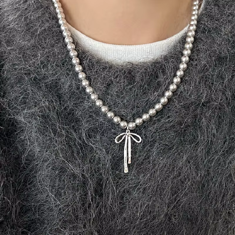 Pendentif ras du cou élégant avec nœud papillon en perles gracieuses pour femmes
