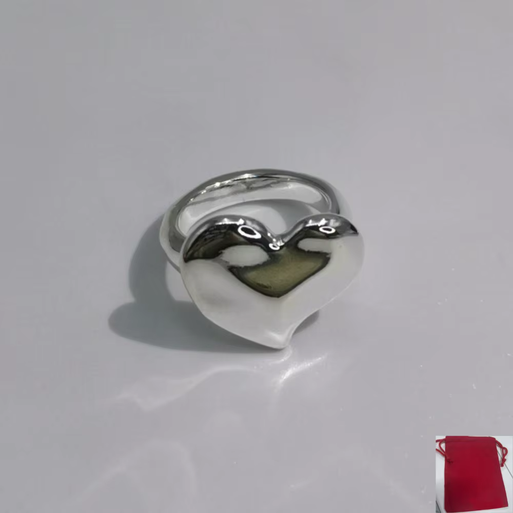 Bague en forme de cœur or et argent
