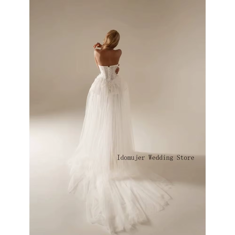 Robe de mariée en tulle superposé ivoire avec corsage bustier