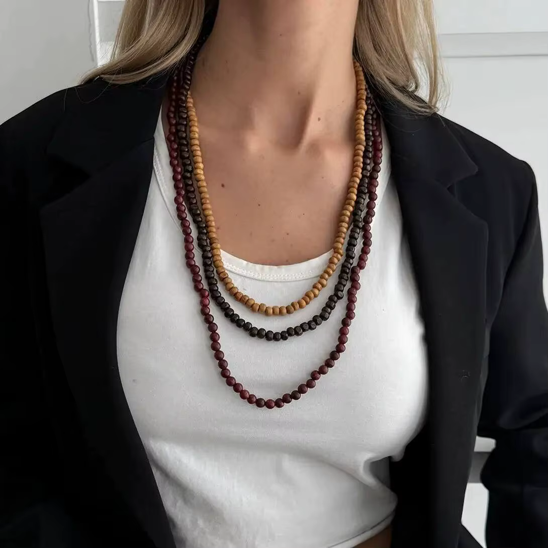 Salircon Collier ras du cou bohémien multicouche en perles de bois pour femmes