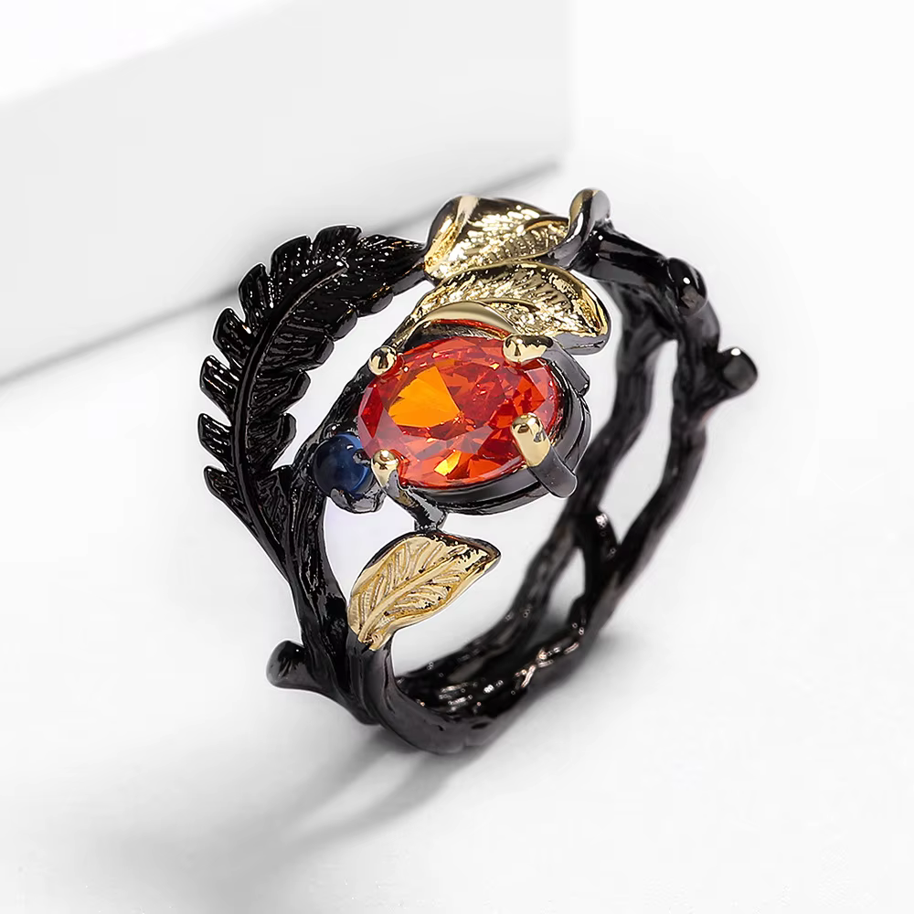 Bague en or noir incrusté de plumes pour femme