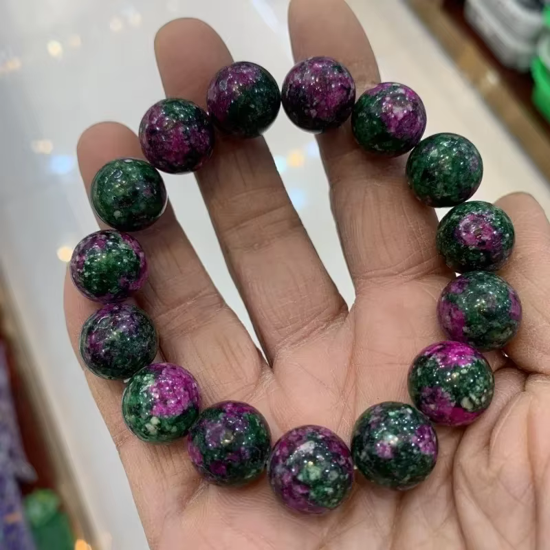 Bracelet de perles rondes en jade de fleur de pêcher colorée