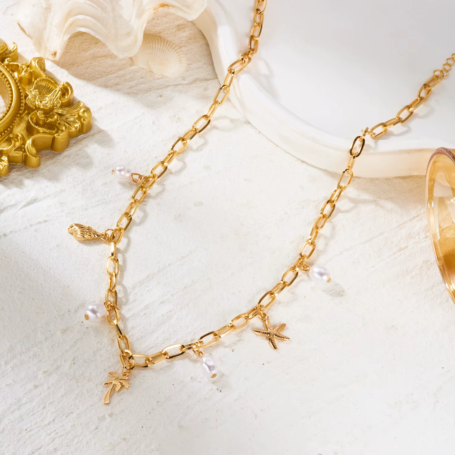 Collier pendentif bohème en métal étoile de mer et conque pour femme