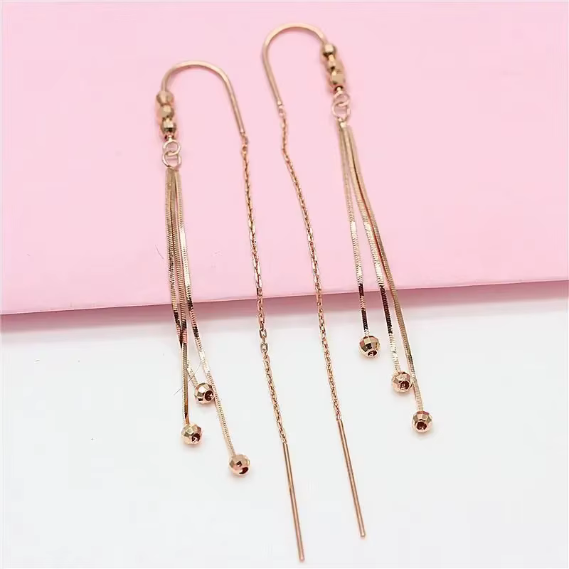 Boucles d'oreilles pompon longue chaîne souple pour femme