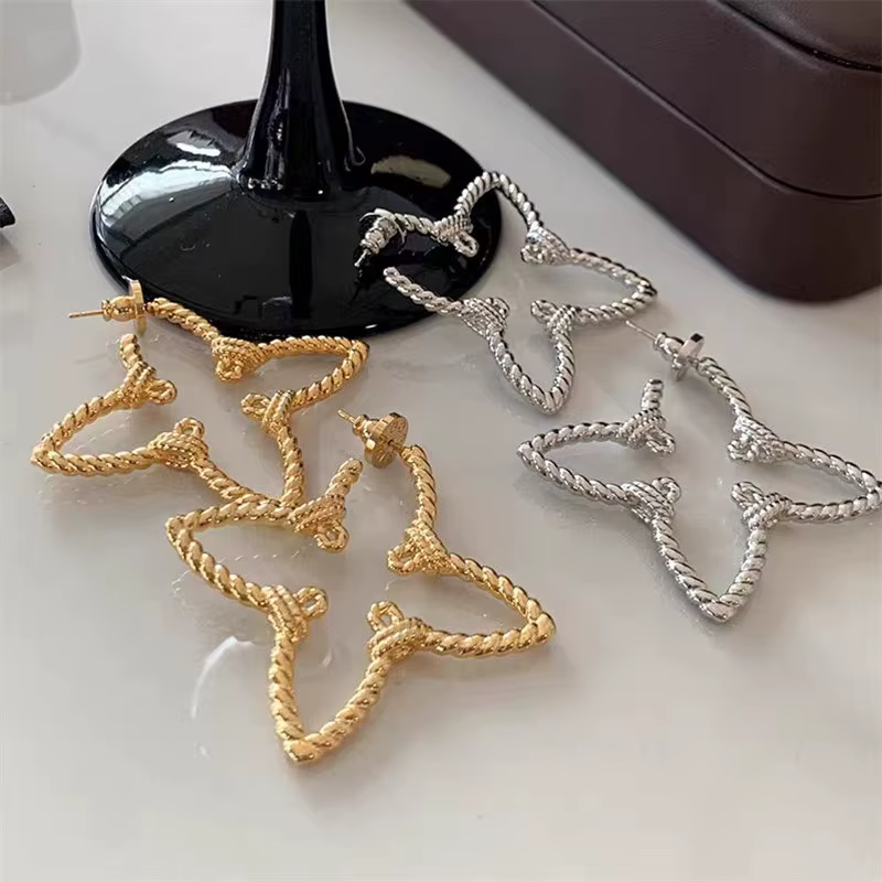 Boucles d'oreilles en métal européennes et américaines exagérées pour femmes