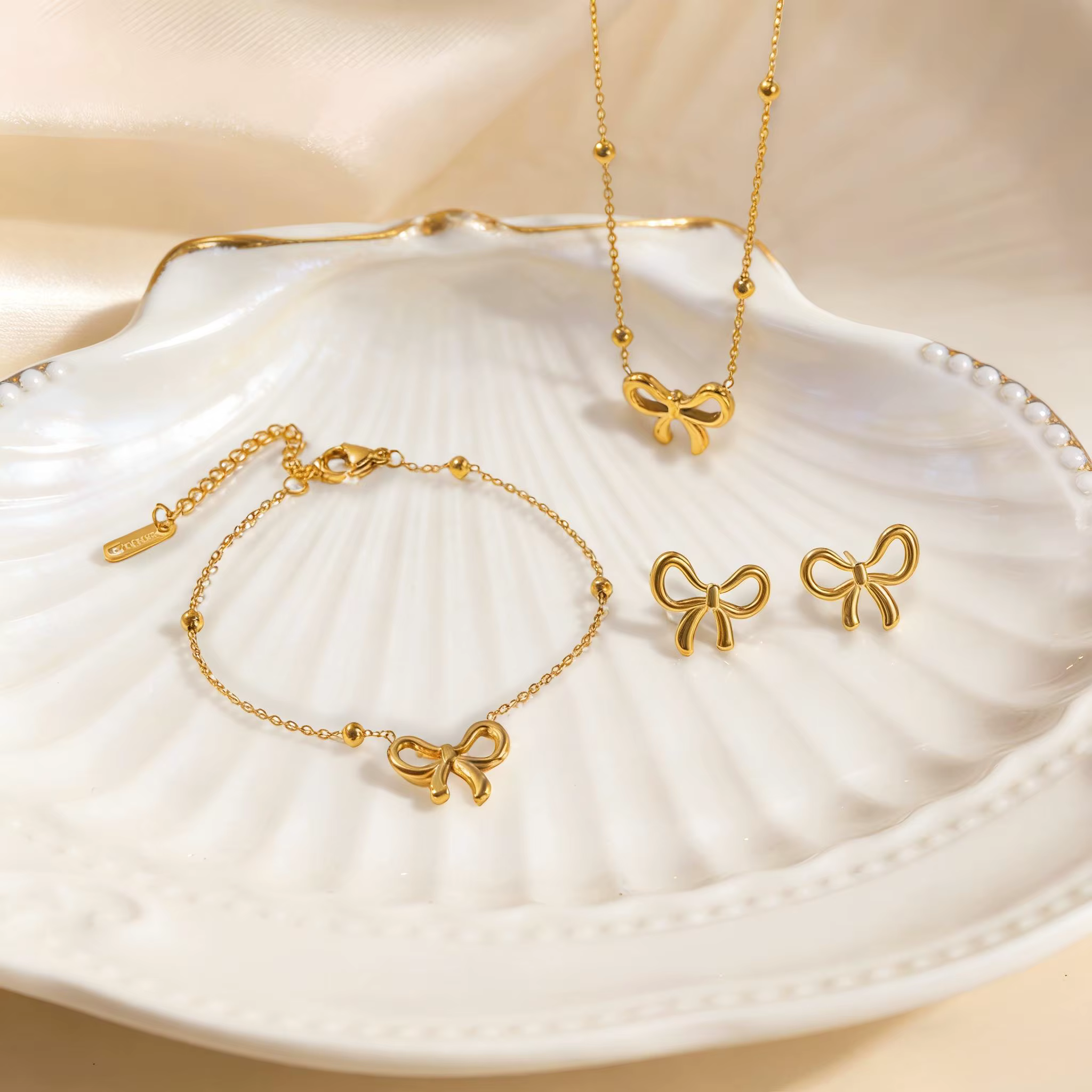 Ensemble de bijoux en acier inoxydable avec nœud papillon