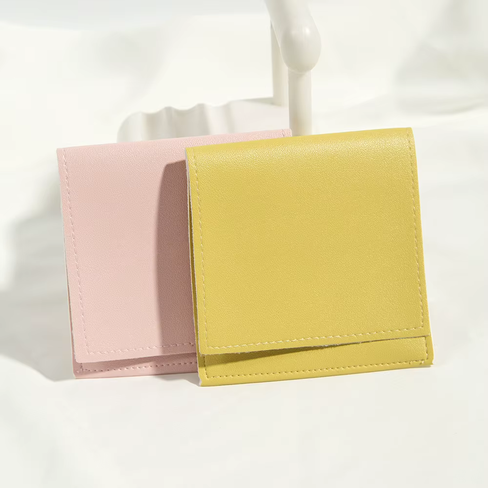100 pochettes en cuir PU pour bijoux
