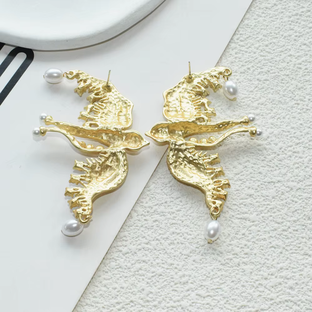 Mode femmes métal plaqué or colombe oiseaux boucles d'oreilles bijoux néo gothique déclaration accessoires