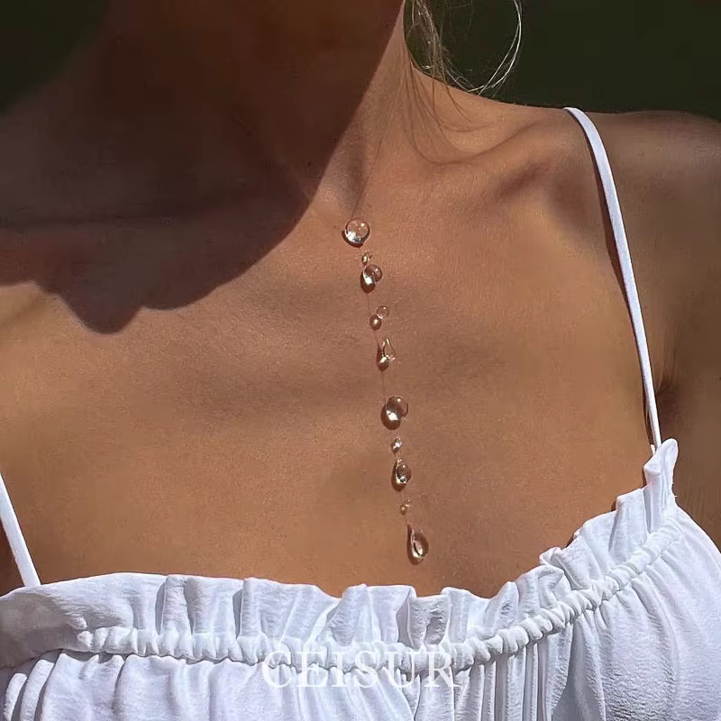 Collier série pompon en forme de goutte de rosée transparente