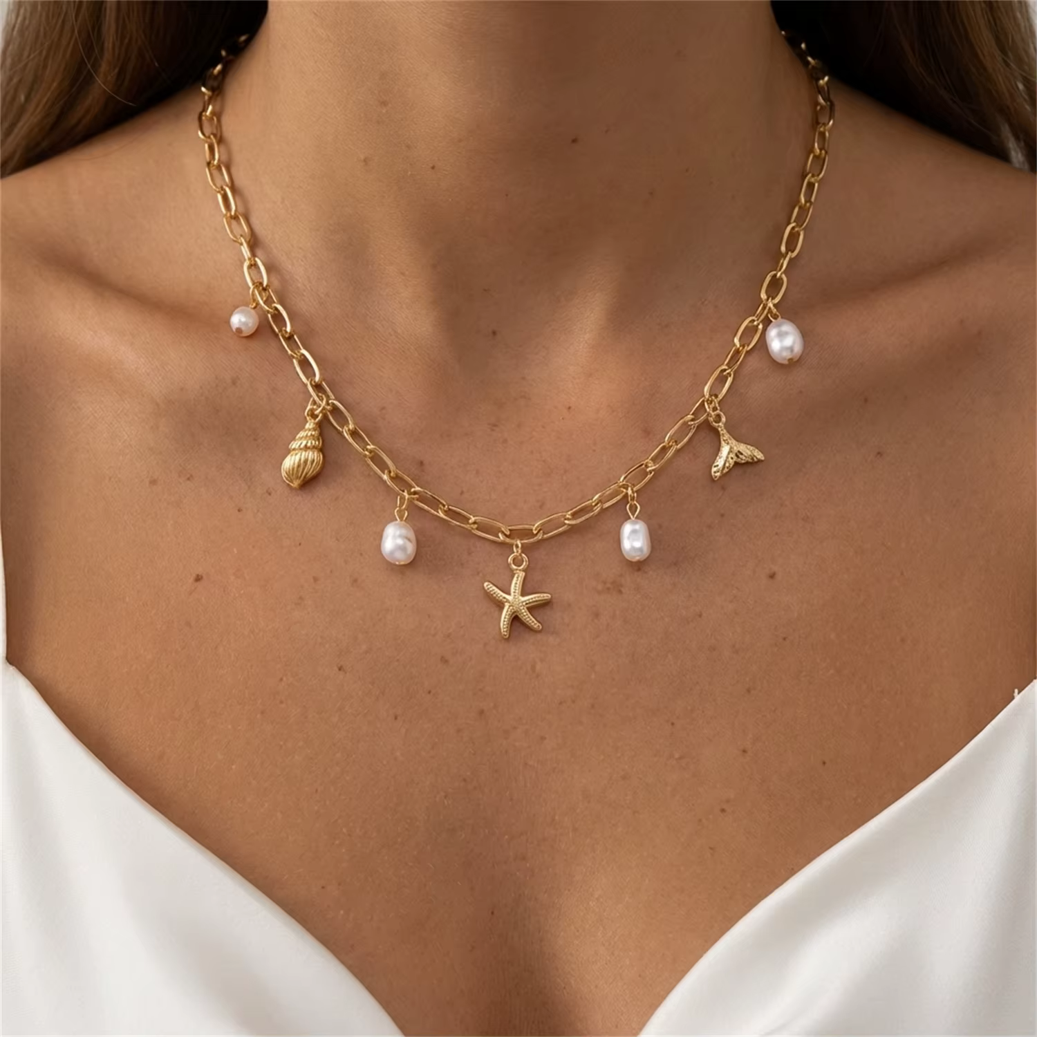 Collier pendentif bohème en métal étoile de mer et conque pour femme