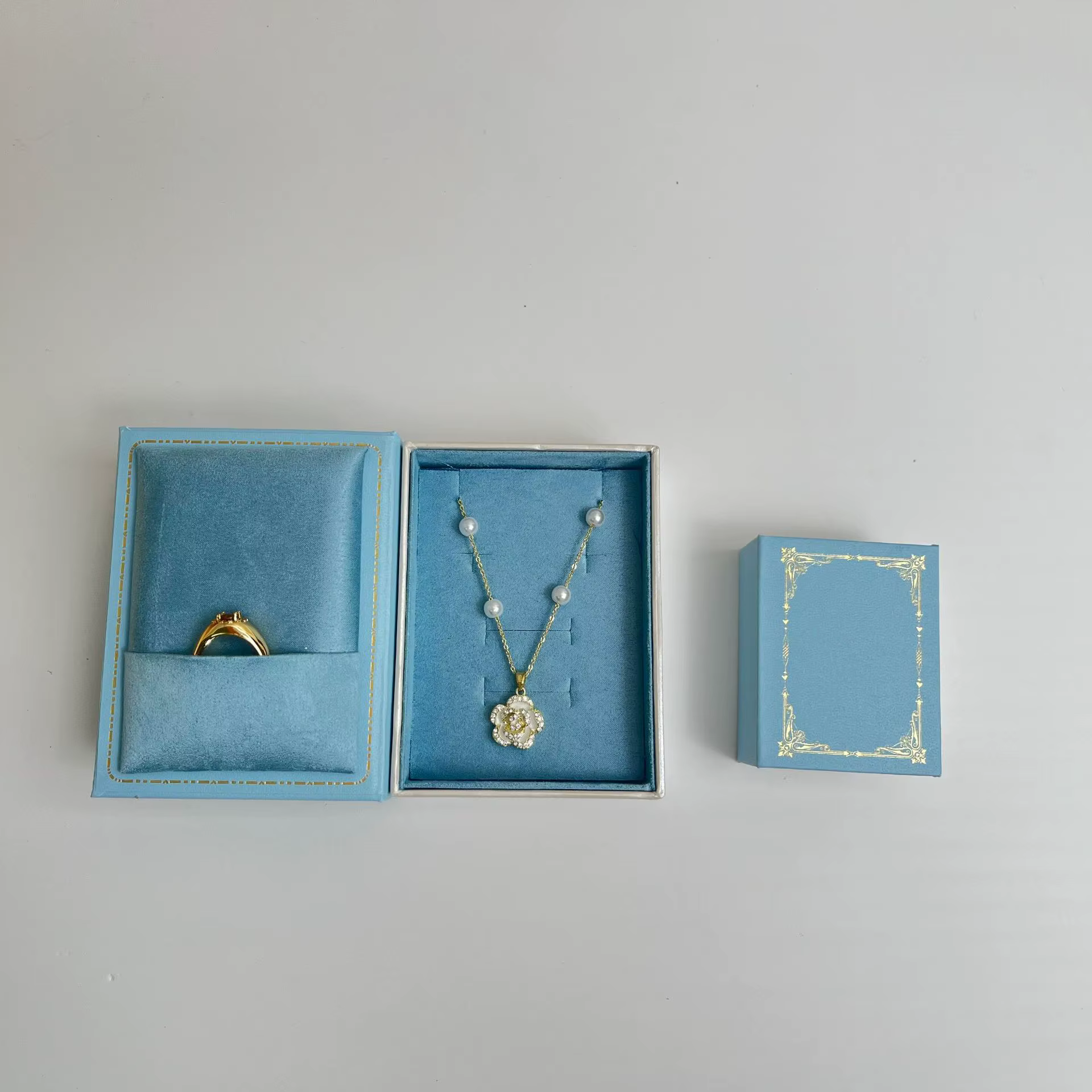Boîte à bijoux magnétique en forme de livre