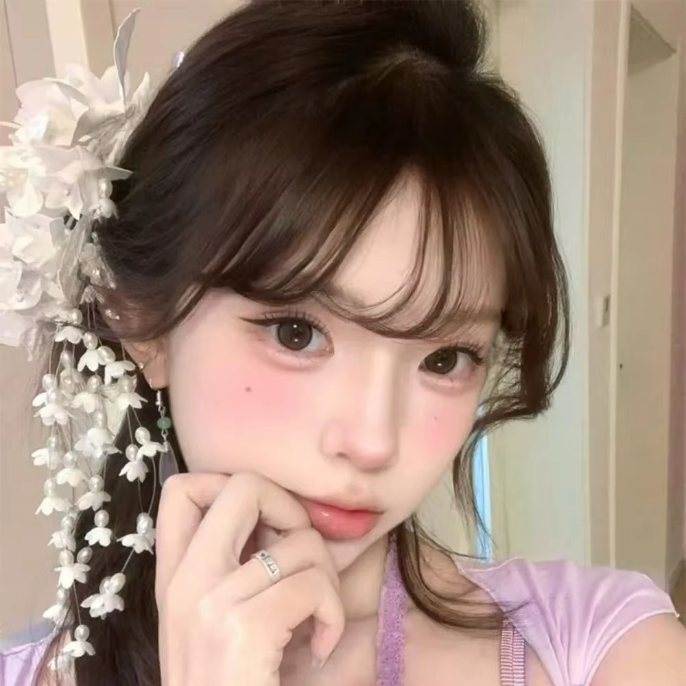 Barrettes à fleurs de luxe avec perles et pompons