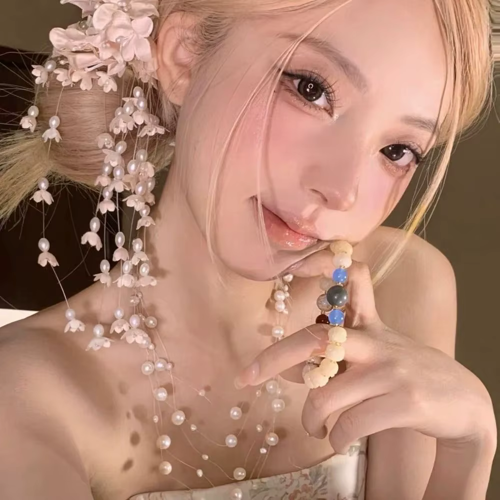 Barrettes à fleurs de luxe avec perles et pompons
