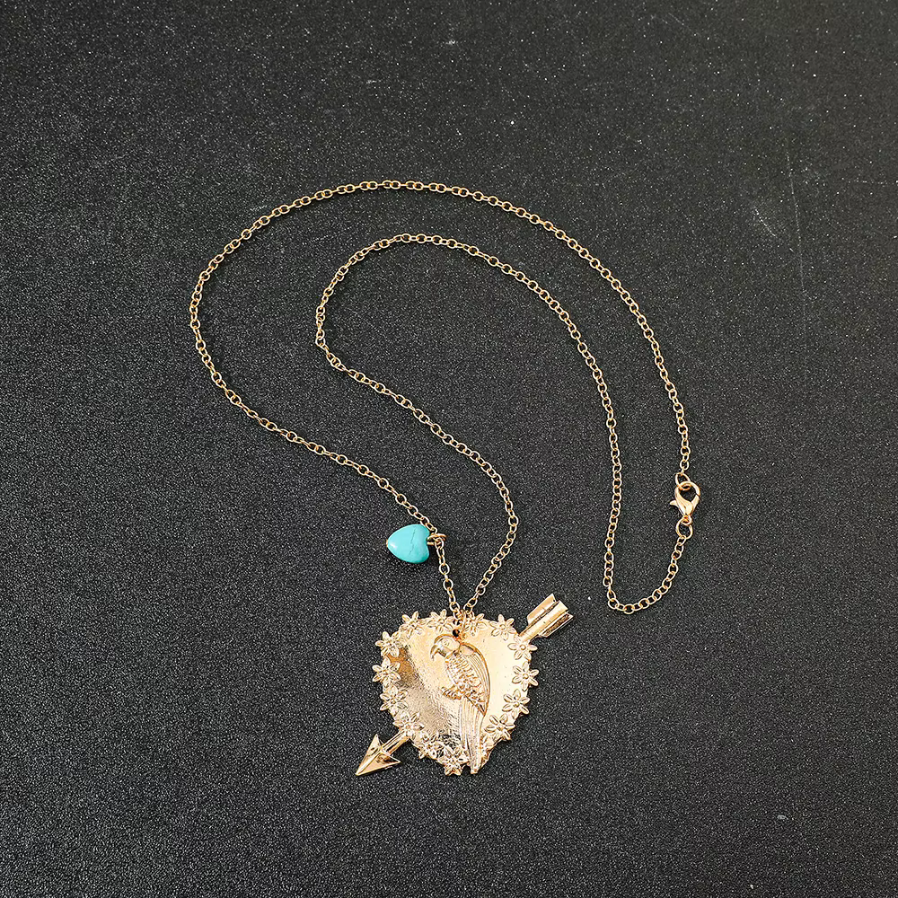 Collier oiseau avec pendentif en forme de cœur pour femme